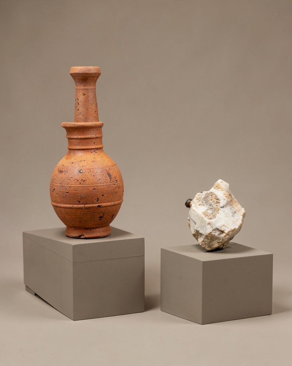 Ancient pottery and antiquities on museum plinths